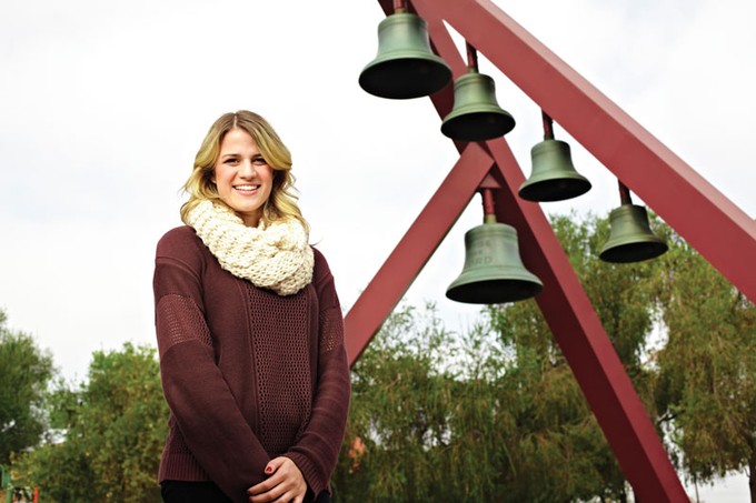 Sarah Evans standing in front of the Biola bell tower