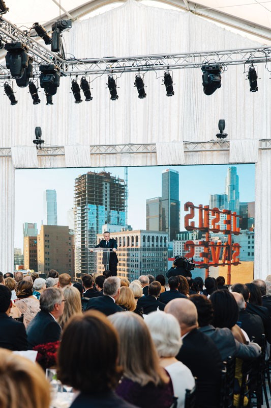 President Barry Corey speaking in front of an audience