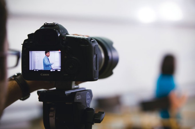 a digital camera with a man on the screen