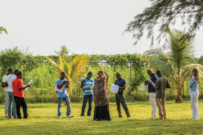 a group of people with cameras standing outside