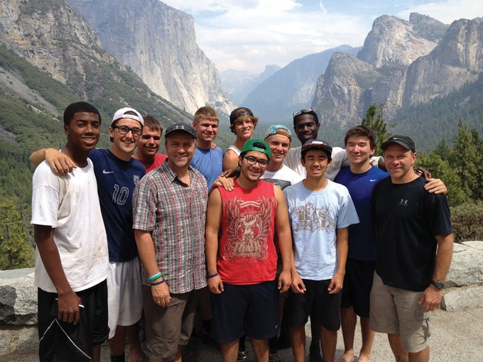 a group of men standing in Yosemite