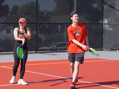young people playing tennis