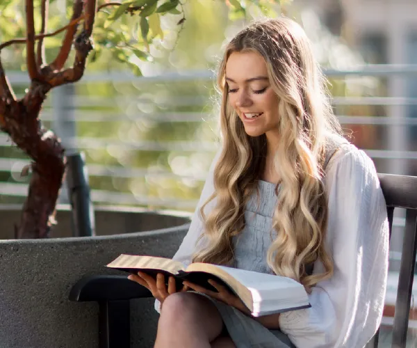 young woman reading a Bible