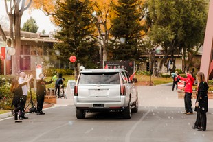 Car driving through commencement line