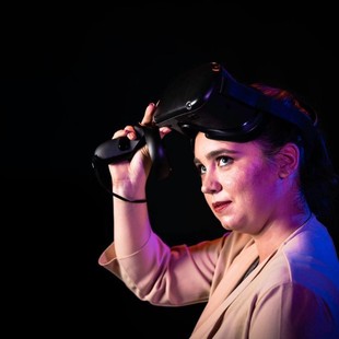 Megan Scott removing a VR headset